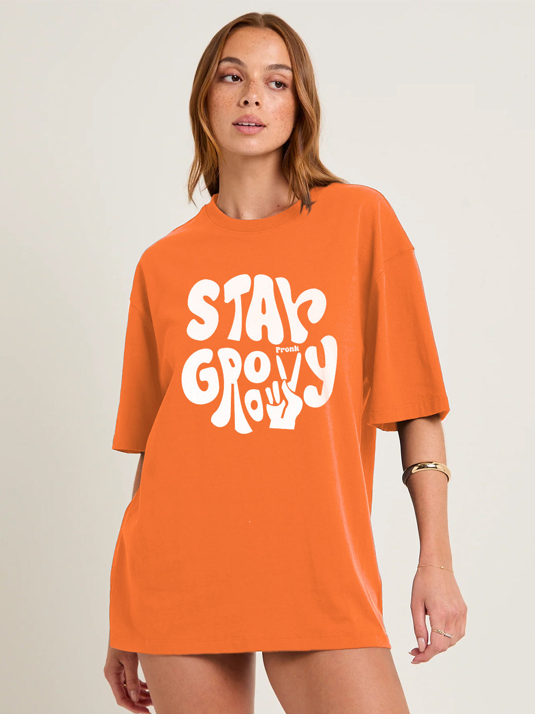 STAY GROOVY Women Graphic Oversized Printed T-Shirt  -  Kurvy Oversized T-Shirt