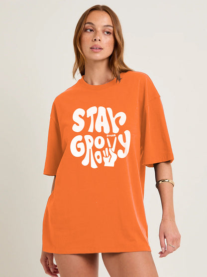 STAY GROOVY Women Graphic Oversized Printed T-Shirt  -  Kurvy Oversized T-Shirt