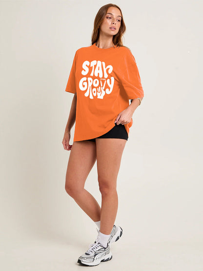 STAY GROOVY Women Graphic Oversized Printed T-Shirt  -  Kurvy Oversized T-Shirt